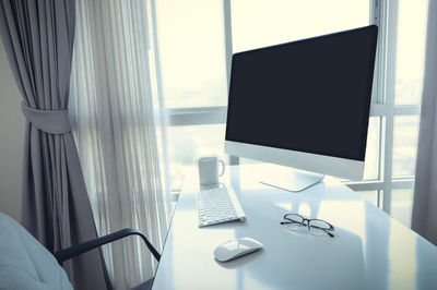 Chairs and table by window in office