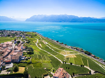 High angle view of sea and mountains against sky