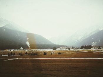 Scenic view of mountains against sky during winter