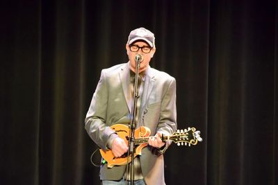 Full length of man playing guitar