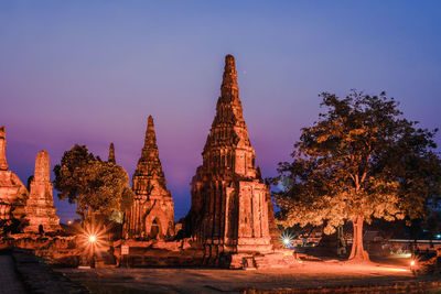 View of illuminated temple building against sky