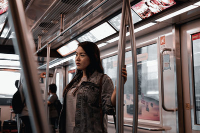 Full length of woman looking at train
