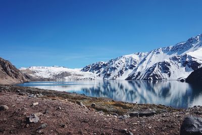 Scenic view of mountains against blue sky