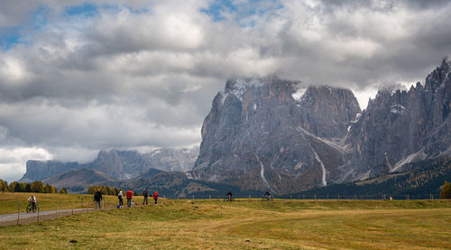 Panoramic view of people on mountain range against sky