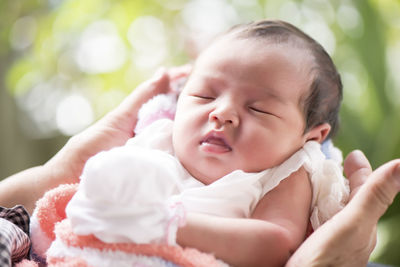 Close-up of cute baby girl sleeping