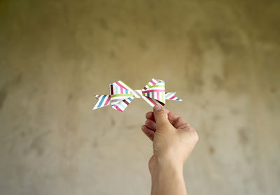 Close-up of hand holding paper