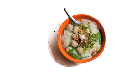 Directly above shot of soup in bowl against white background