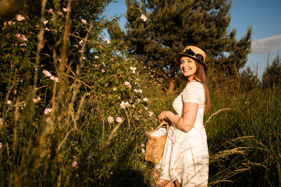 Portrait of young woman wearing hat