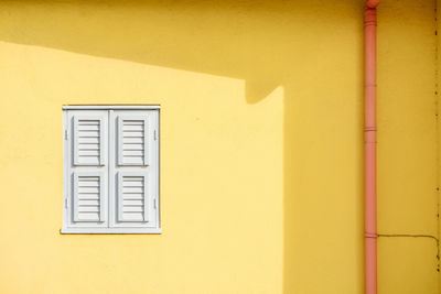 Full frame shot of yellow wall of building