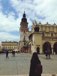 People walking in front of cathedral