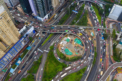 Aerial view of vehicles moving on road in city