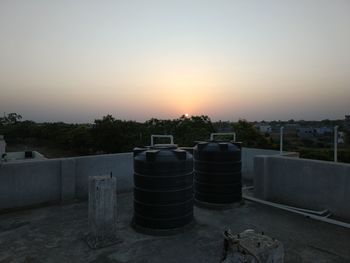 Container against sky at sunset