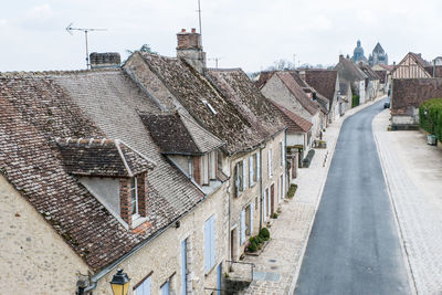 Buildings in town against sky