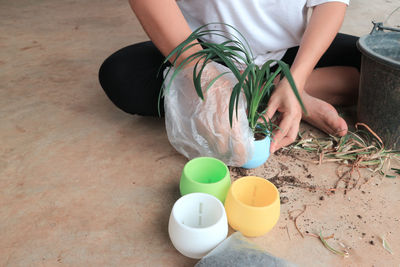 Low section of woman sitting outdoors