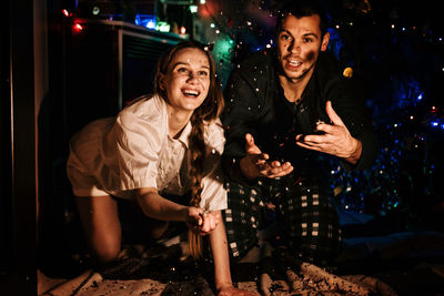 Merry christmas and happy new year. young couple in love celebrating christmas or new year eve at