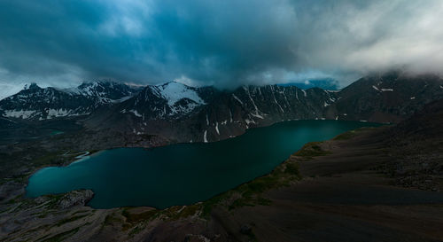 Ala-kul lake from the alakel mountain, karakol, kyrgyzstan. panoramic horizontal photo.