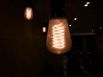 Low angle view of illuminated light bulb