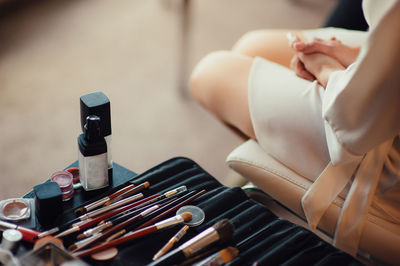 High angle view of woman sitting on table