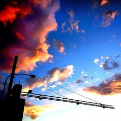 Low angle view of cloudy sky at sunset