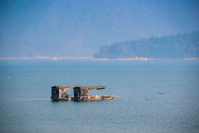 Scenic view of sea against blue sky