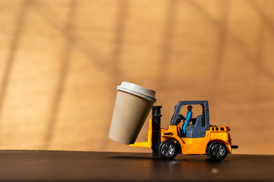 Close-up of toy car on wood