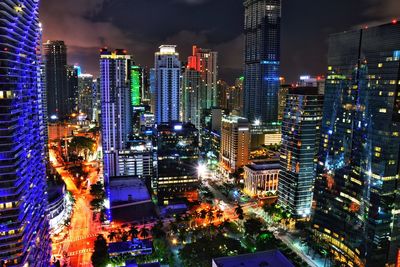 Aerial view of city lit up at night