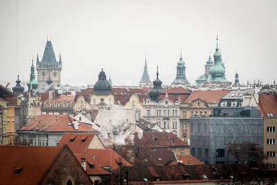 Buildings in city against sky