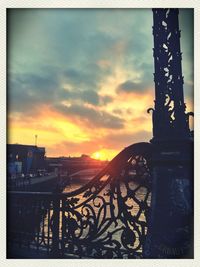 Silhouette of built structure at sunset