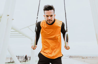 Male athlete exercising at beach