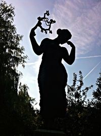 Low angle view of statue against sky