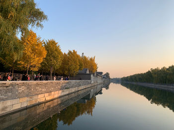 Scenic view of lake against clear sky during autumn