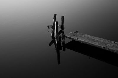 High angle view of wooden post in lake