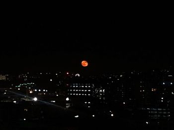 Illuminated cityscape at night