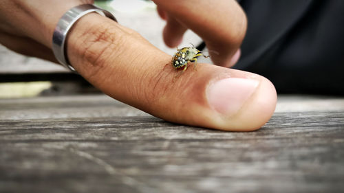 Close-up of human hand on table