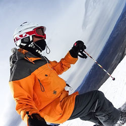 Low angle view of man standing on mountain