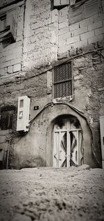 Low angle view of weathered wall of old building