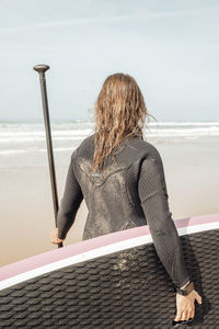 Surfing girl on the ocean