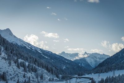 Scenic view of snowcapped mountains against sky