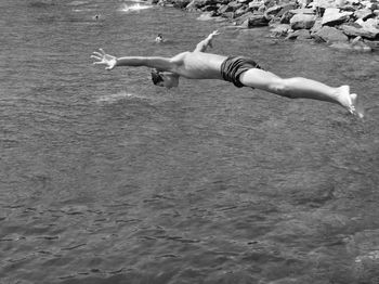 Full length of man jumping on beach
