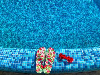 High angle view of red floating on swimming pool