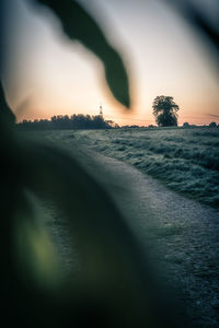 Scenic view of land against sky during sunset