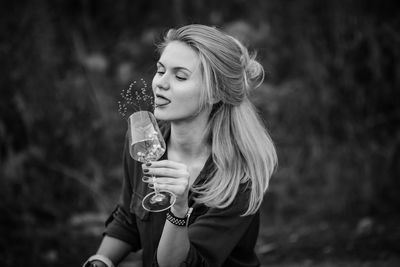 Young woman drinking beer glass