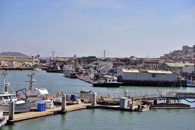 Boats moored at harbor