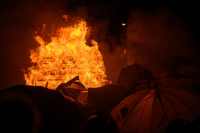 View of bonfire at night