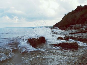 Scenic view of sea against cloudy sky