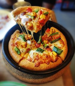 High angle view of pizza in plate on table