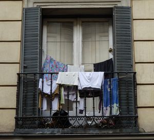 Low angle view of clothes drying on balcony