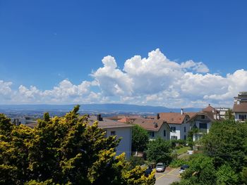 High angle view of trees and buildings against sky