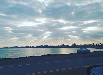 Scenic view of sea against cloudy sky