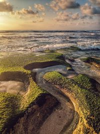 Scenic view of sea against sky during sunset